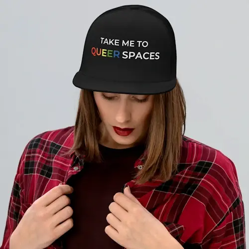 TAKE ME TO QUEER SPACES Trucker Cap in Black with logo